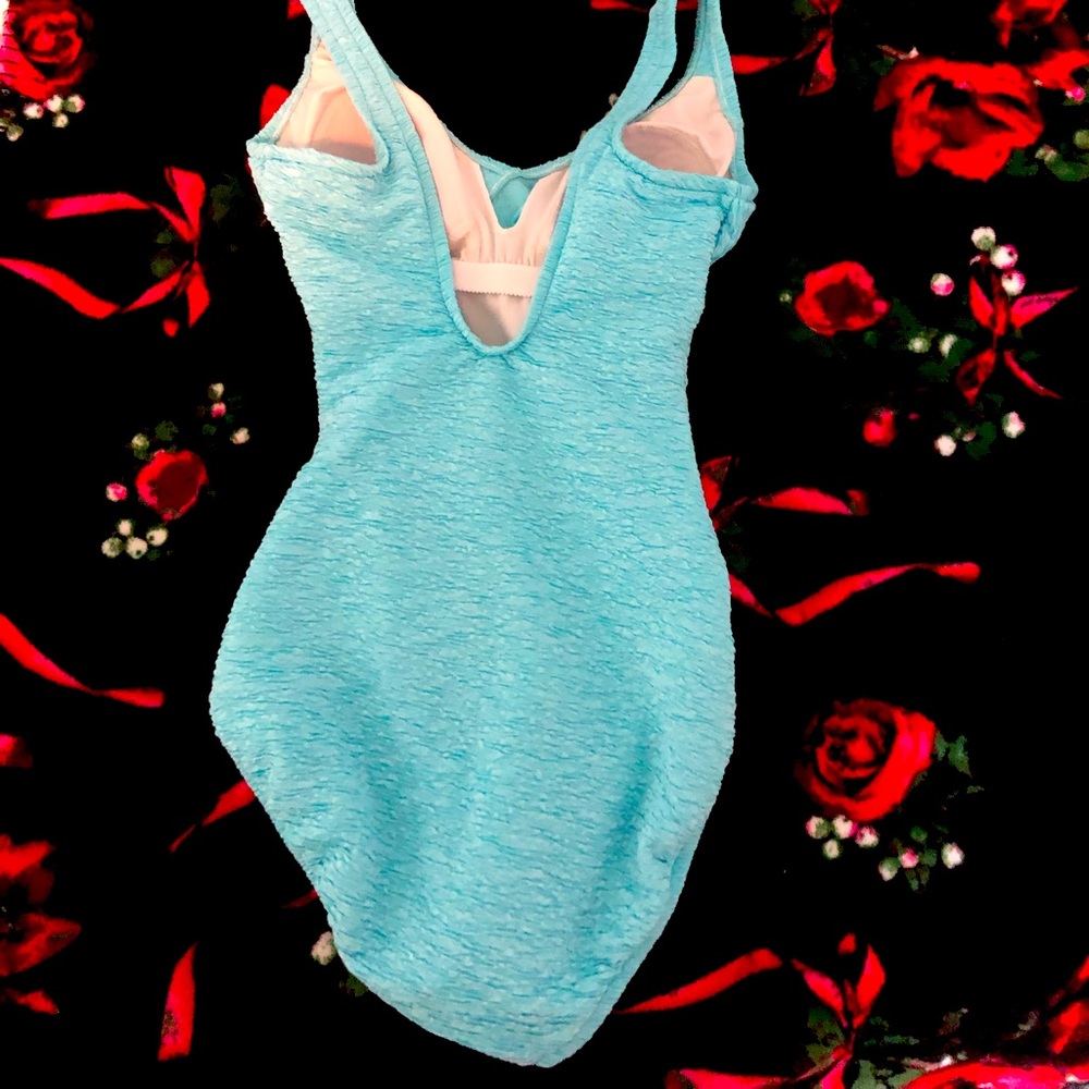 I am selling this sea blue one piece bathing suit from Belk.